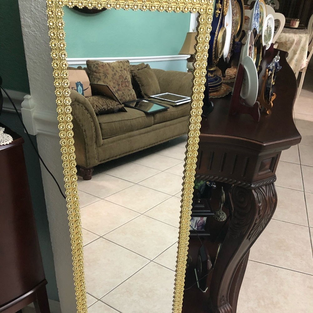 Gold decor on gold frame mirror